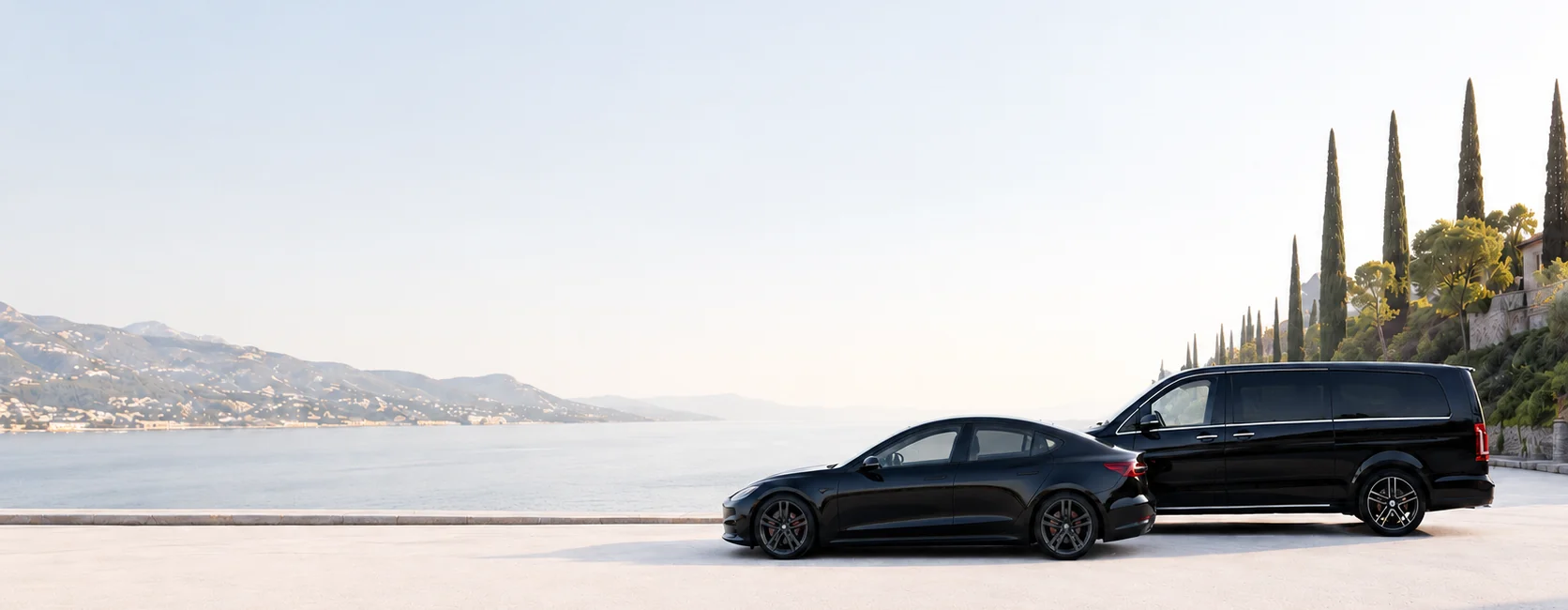 Black sedan and van overlooking the French Riviera coastline